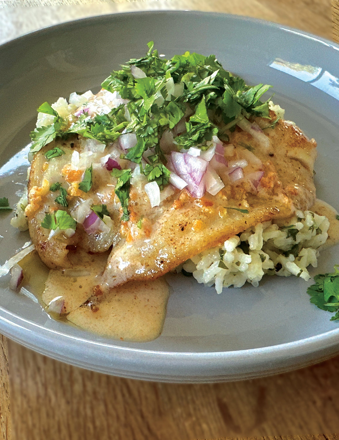 Nicco's Fijian Fish Dish. Sole, Cilantro & Red Onion with Coconut Cream Sauce over Lime and Cilantro Rice.